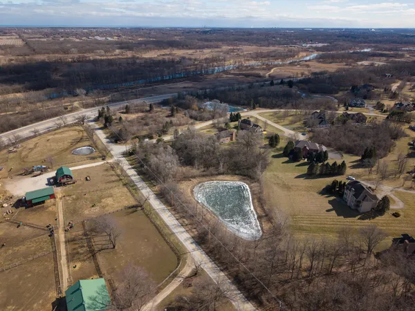 an aerial view of residential houses with outdoor space