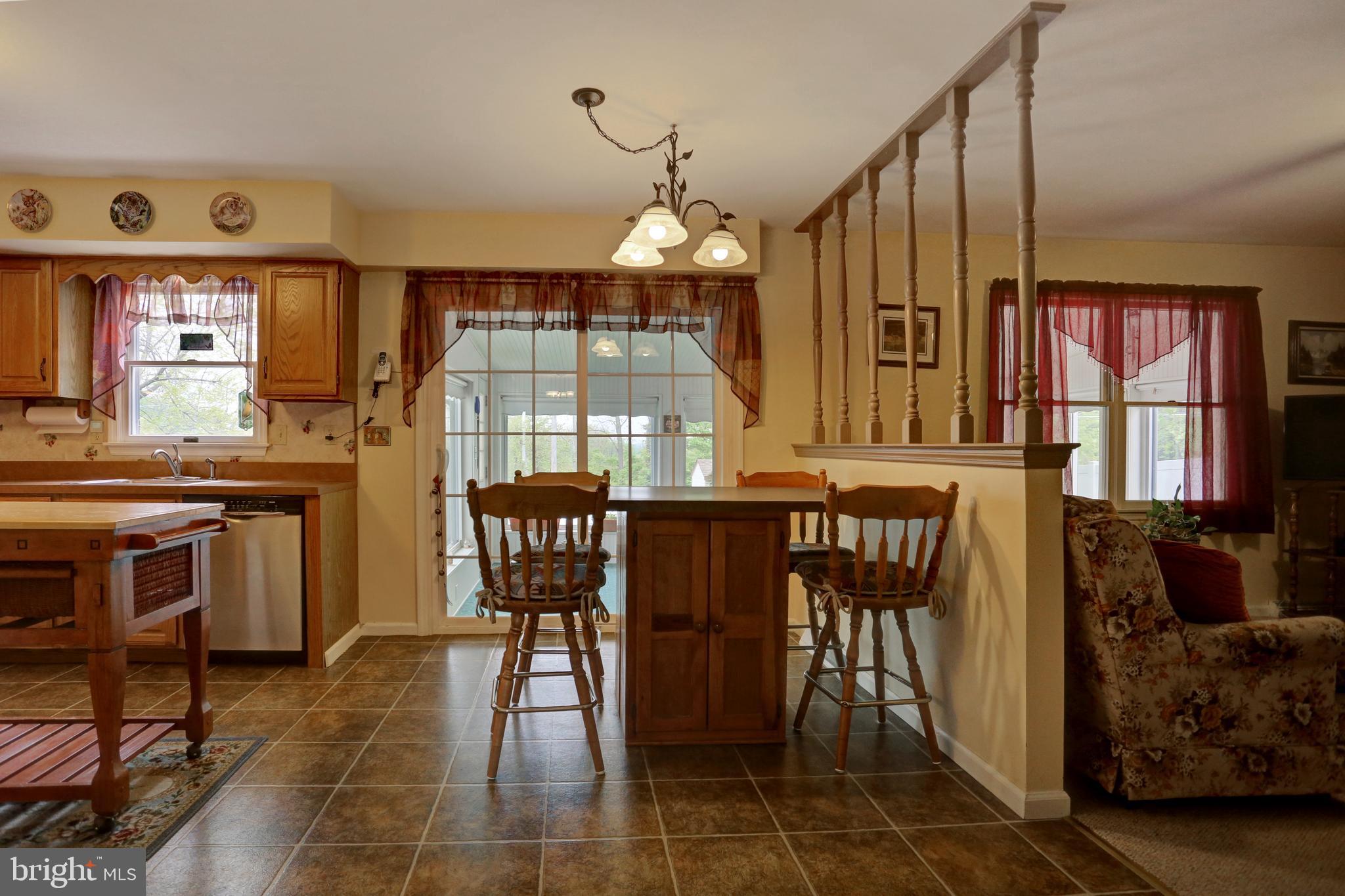 806 Blue Gate Lane Sinking Spring, PA 19608 - Photo 10 of 26 Kitchen looking out to 4-season room