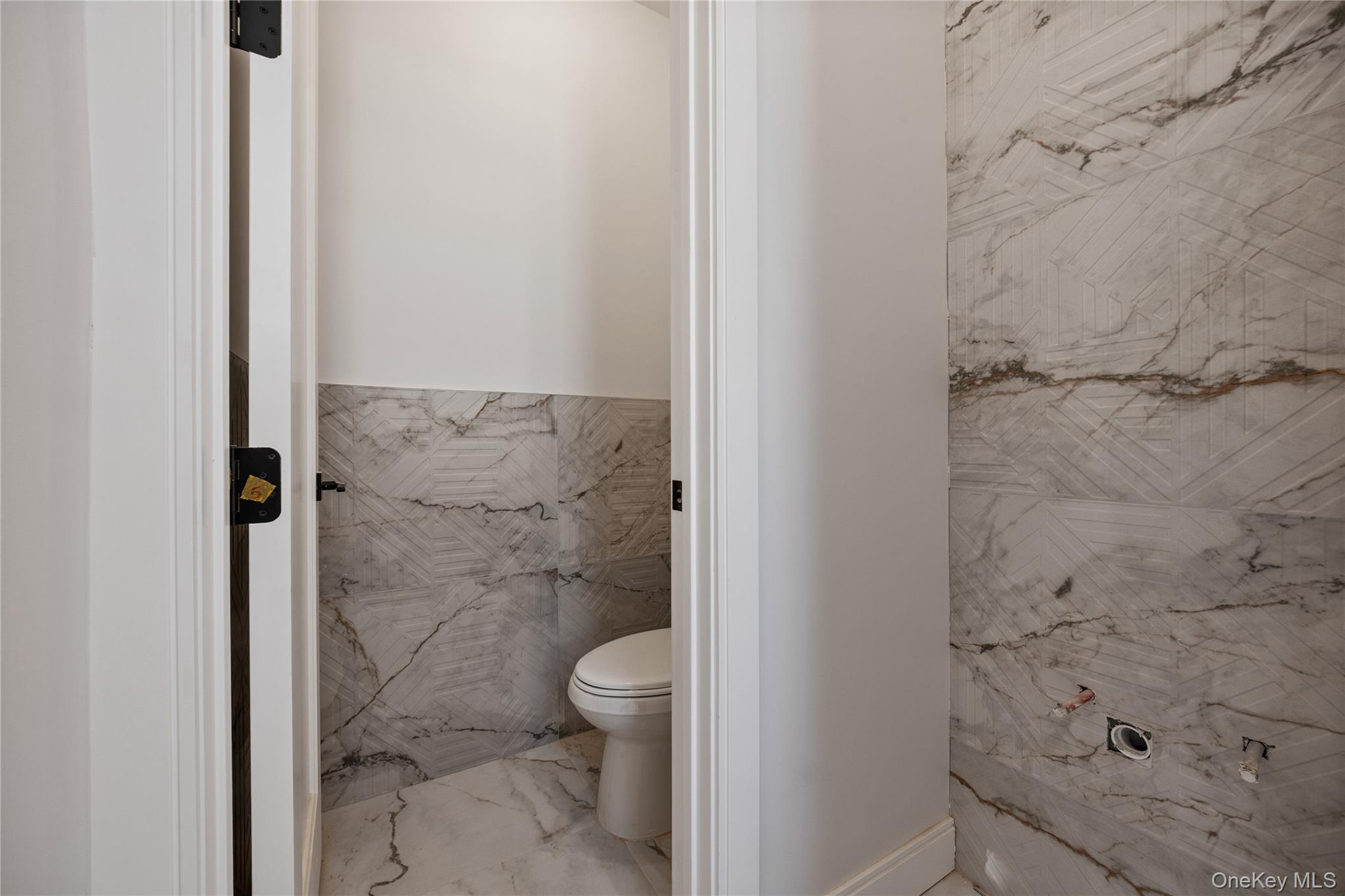 20 West Funston Avenue, Unit 212 Spring Valley, NY 10977 - Photo 11 of 34 a bathroom with a toilet and a shower