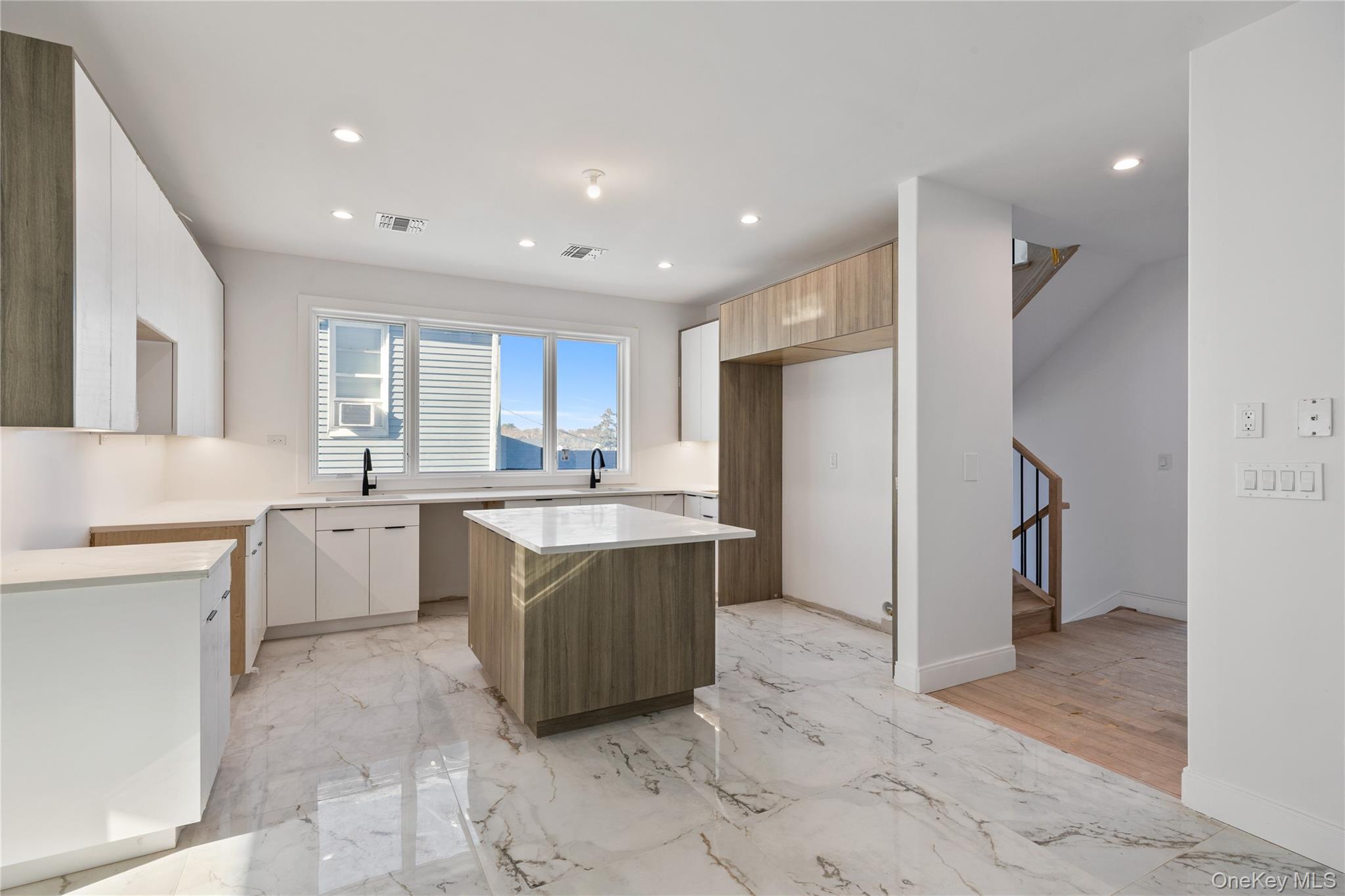 20 West Funston Avenue, Unit 212 Spring Valley, NY 10977 - Photo 13 of 34 a large kitchen with stainless steel appliances granite countertop a refrigerator and a sink