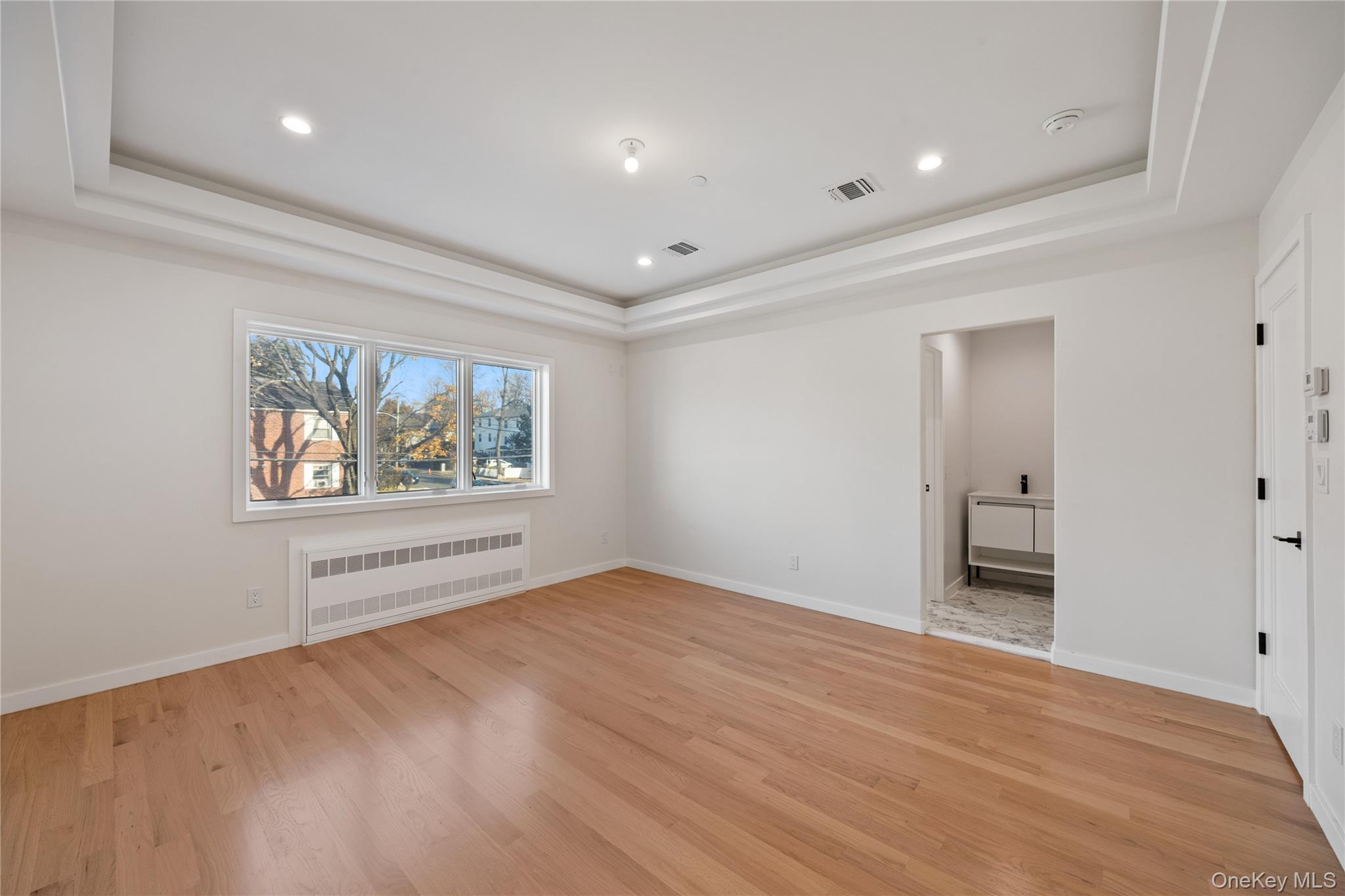 20 West Funston Avenue, Unit 212 Spring Valley, NY 10977 - Photo 19 of 34 wooden floor in an empty room with a window