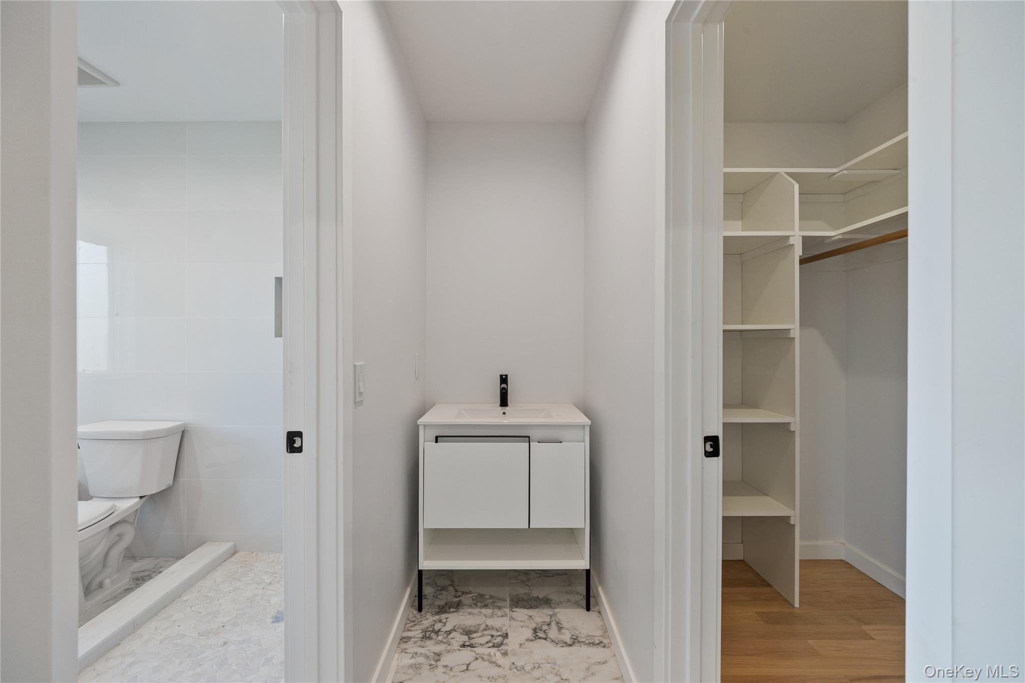 20 West Funston Avenue, Unit 212 Spring Valley, NY 10977 - Photo 20 of 34 a bathroom with a sink toilet and shower