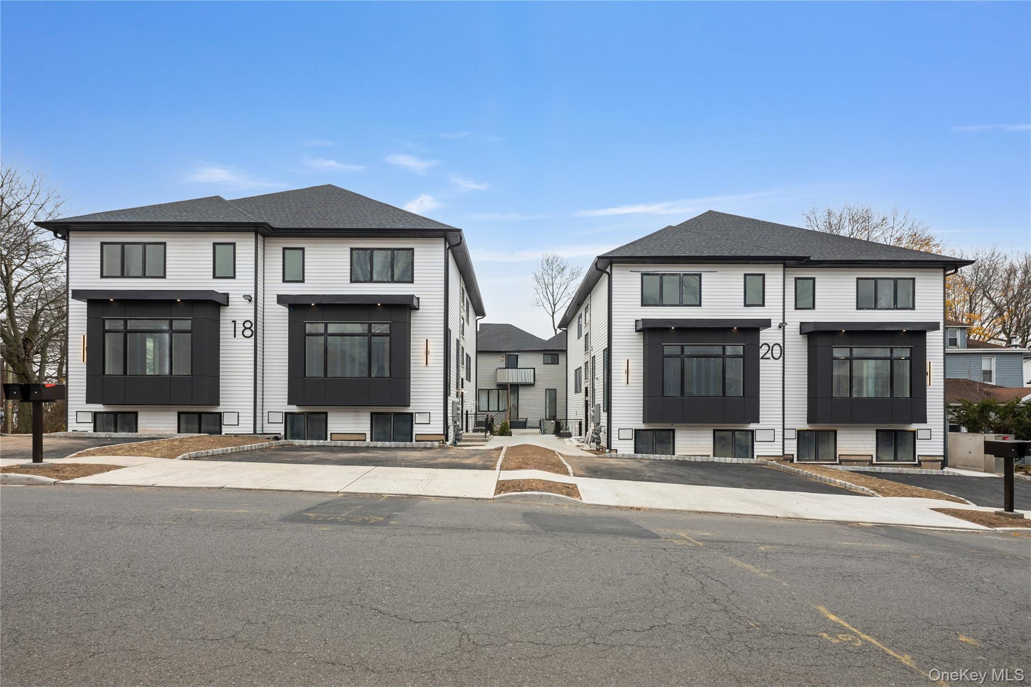 20 West Funston Avenue, Unit 212 Spring Valley, NY 10977 - Photo 2 of 34 a front view of multiple houses
