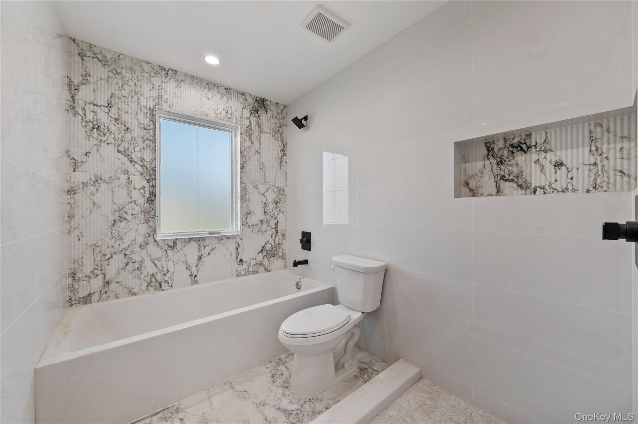 20 West Funston Avenue, Unit 212 Spring Valley, NY 10977 - Photo 21 of 34 a bathroom with a toilet a sink and bathtub