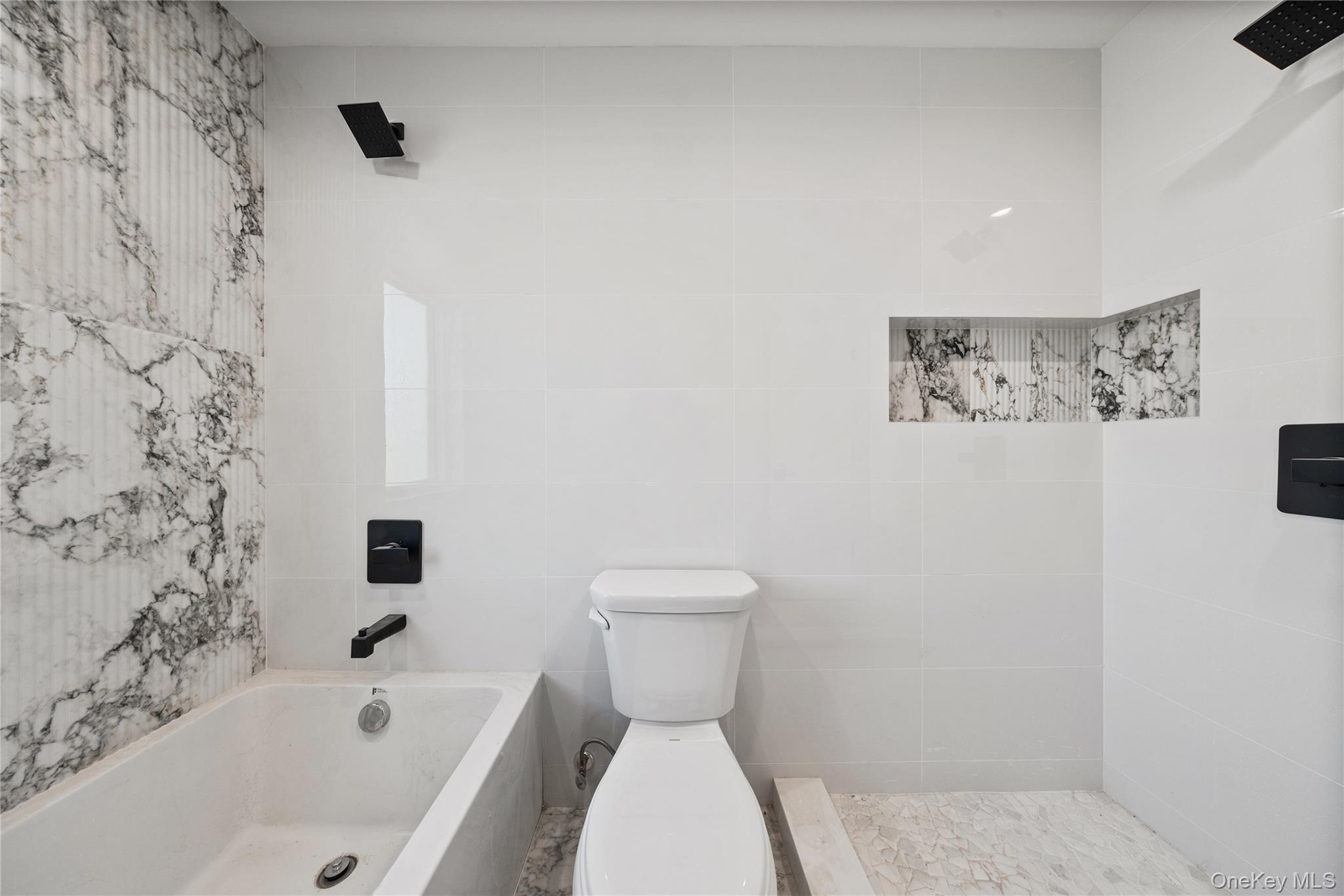 20 West Funston Avenue, Unit 212 Spring Valley, NY 10977 - Photo 22 of 34 a bathroom with a toilet and a bathtub