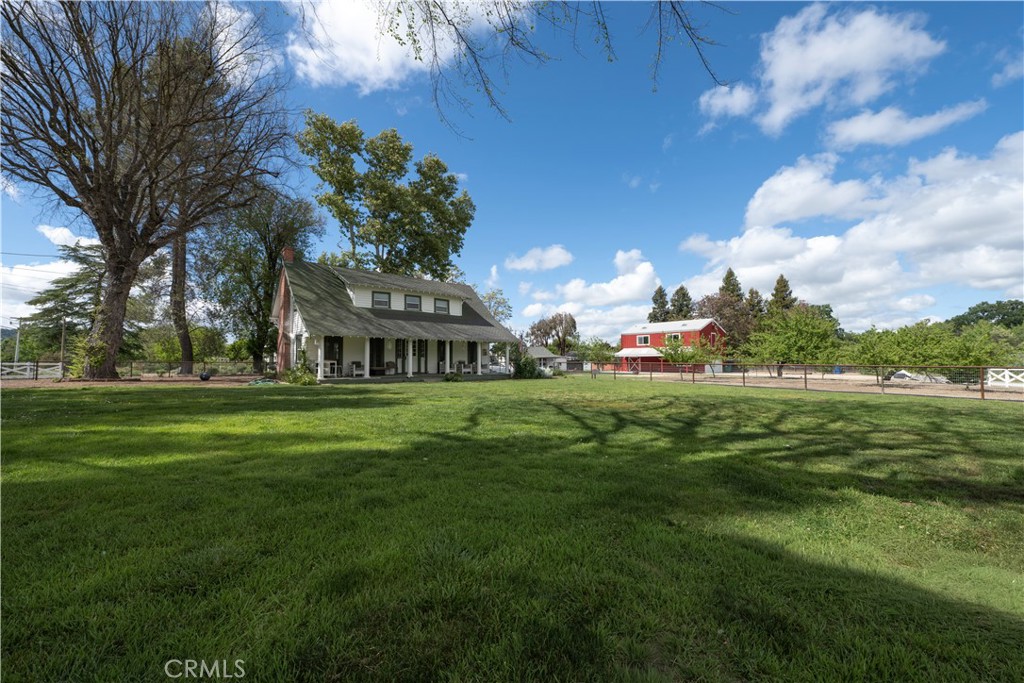 a view of a house with a big yard