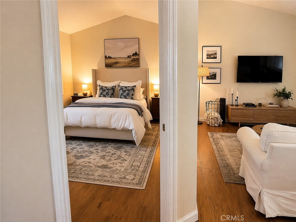 17490 Poplar Atascadero, CA 93422 - Photo 13 of 24 a bedroom with a bed and flat screen tv