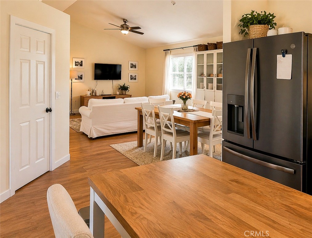 17490 Poplar Atascadero, CA 93422 - Photo 14 of 24 a living room with stainless steel appliances kitchen island granite countertop furniture and a flat screen tv