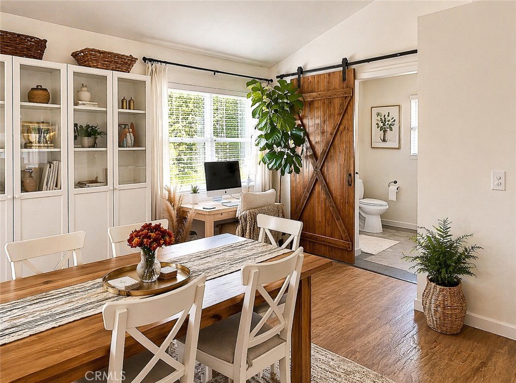17490 Poplar Atascadero, CA 93422 - Photo 17 of 24 a dining room with furniture potted plants and wooden floor