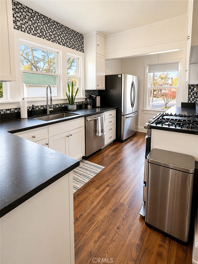 17490 Poplar Atascadero, CA 93422 - Photo 9 of 24 a kitchen with stainless steel appliances a refrigerator a stove a sink and a microwave
