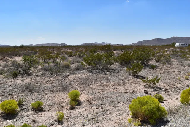 a view of a road with a ocean view