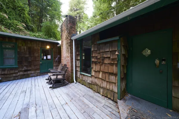 a view of a two chairs in the balcony