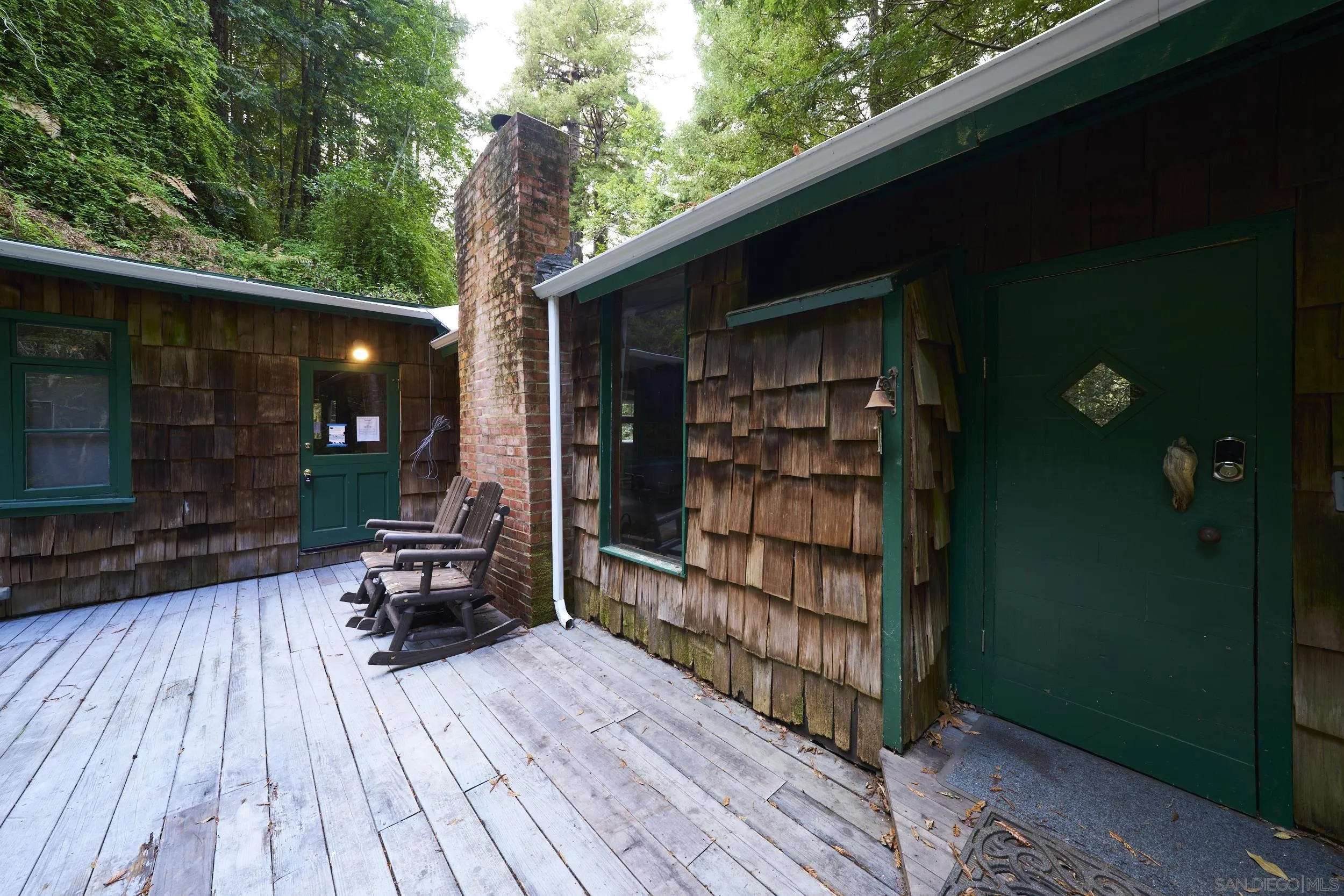 a view of a two chairs in the balcony