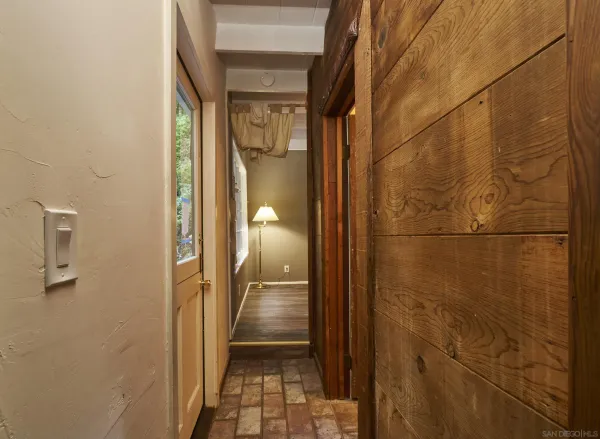 a bathroom with a shower and a glass door
