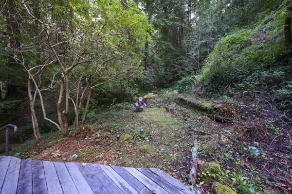 a view of a backyard with sitting area