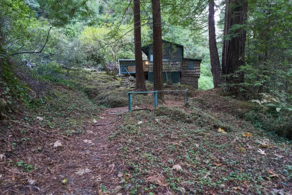 a view of a house with a yard and sitting area