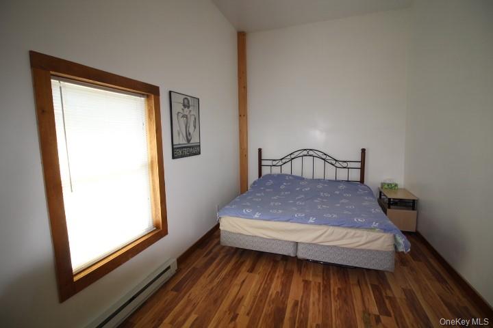 13 Creamery Road Livingston Manor, NY 12758 - Photo 13 of 22 Bedroom featuring baseboard heating and wood finished floors