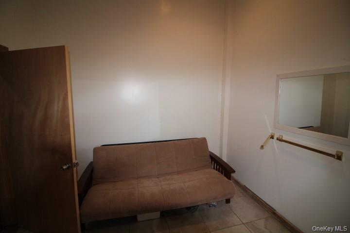 13 Creamery Road Livingston Manor, NY 12758 - Photo 19 of 23 Living area featuring tile patterned floors and baseboards