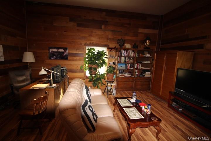 13 Creamery Road Livingston Manor, NY 12758 - Photo 7 of 23 Living room with wood finished floors and wooden walls