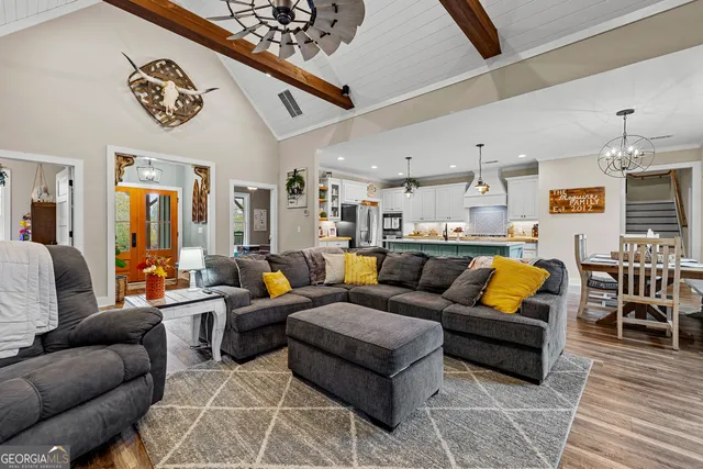 a kitchen with stainless steel appliances granite countertop sink stove and refrigerator