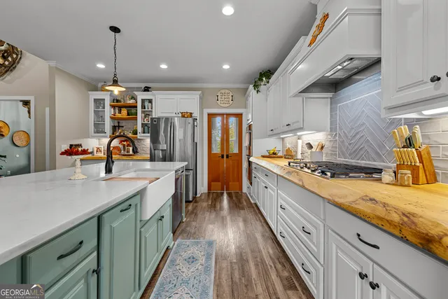 a bathroom with a white bath tub and a shower