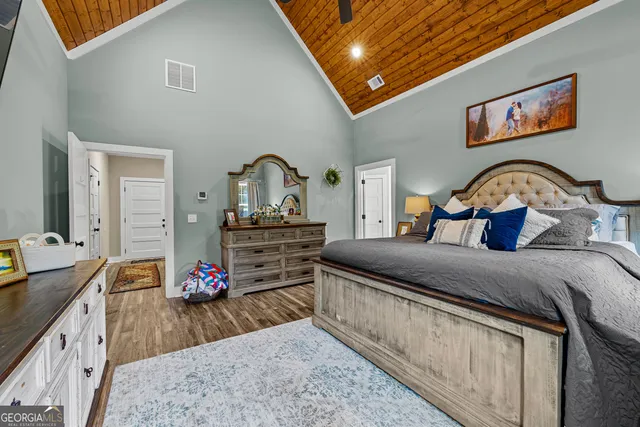 a view of a hallway with paintings on the wall