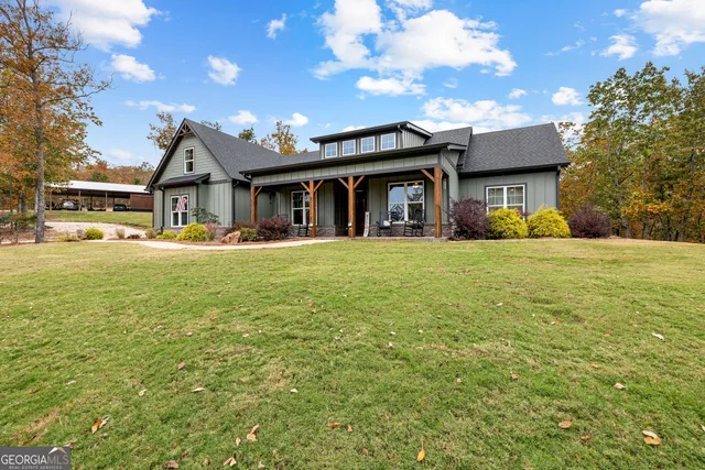 a view of a hallway view with wooden floor and furniture