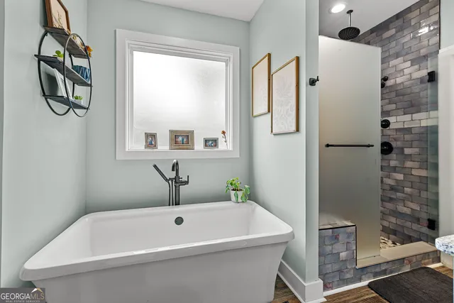 a bed room with a bed mirror and a window