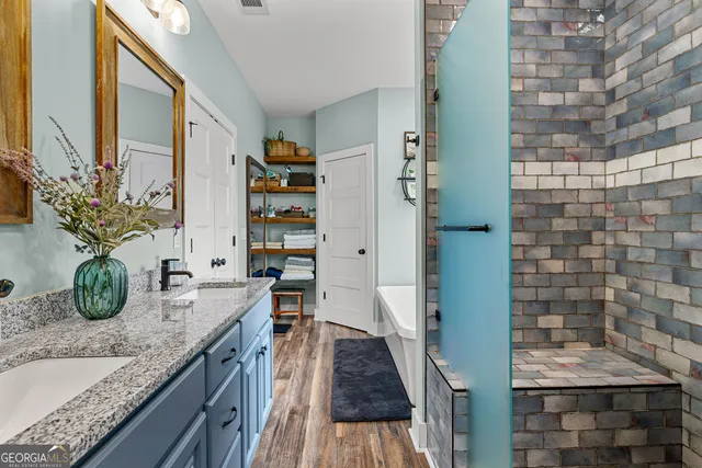 a bedroom with bed and a chandelier