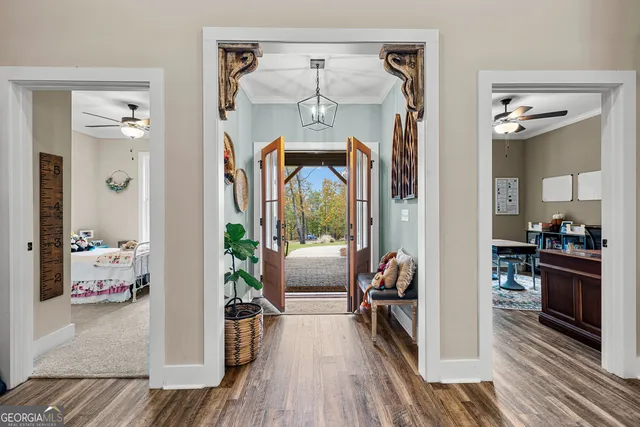 a living room with furniture kitchen view and a table