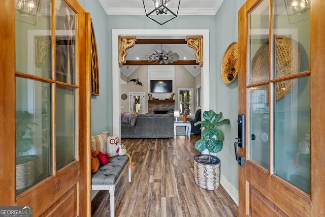 a living room with furniture and kitchen view