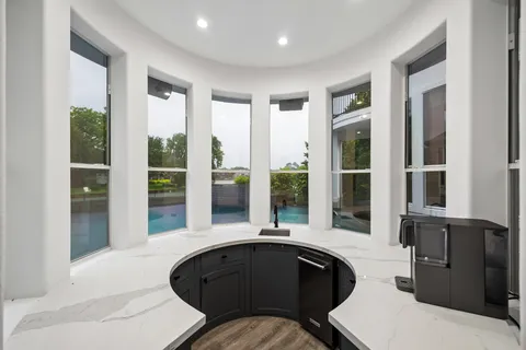 a kitchen with a sink and a large window