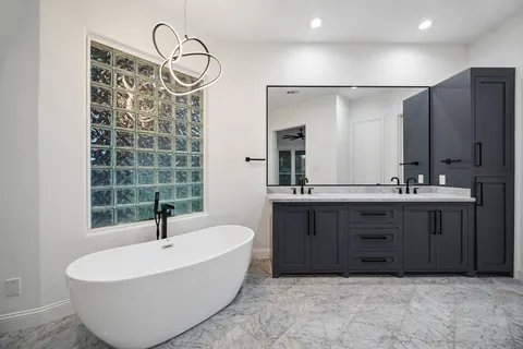 a bathroom with a bathtub and a sink