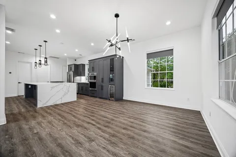 a view of a kitchen with a sink and a kitchen view