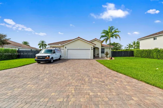 a house with a yard and a garden