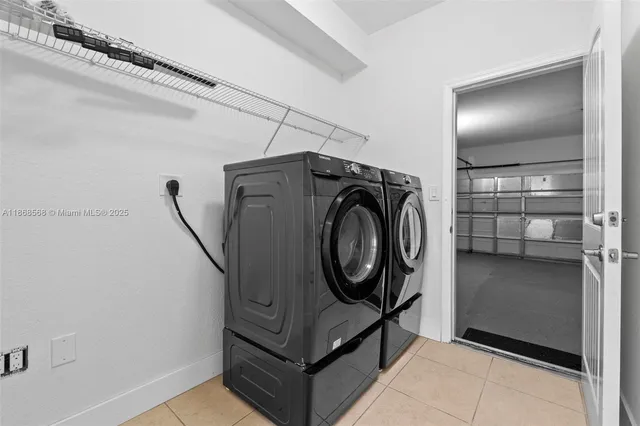 a utility room with washer and dryer