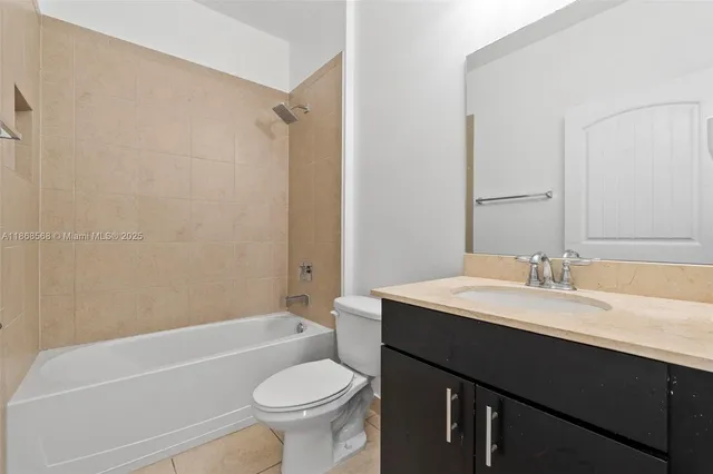 a bathroom with a sink a toilet and a bathtub