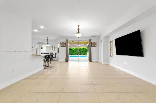 a view of a livingroom with furniture and a flat screen tv