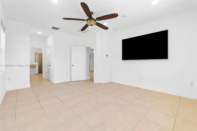 a view of a livingroom with a flat screen tv