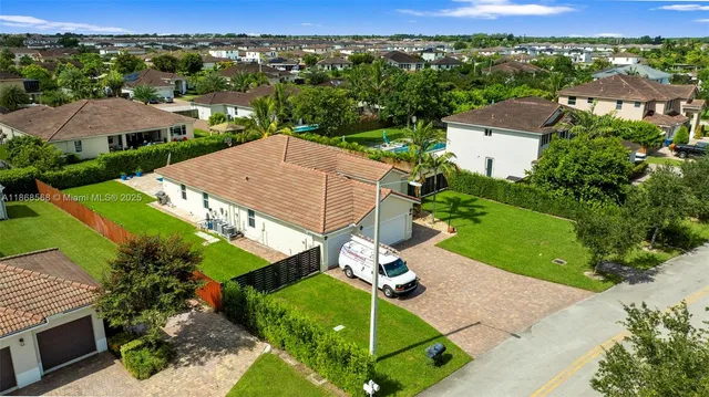 an aerial view of a house with a garden