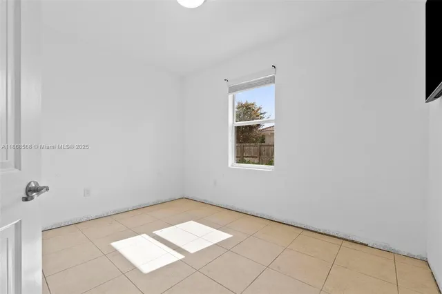 a view of a room that has a window in it