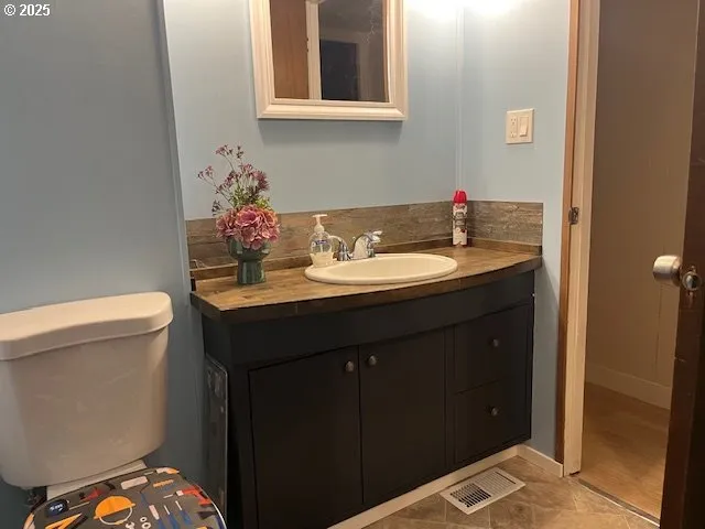 a bathroom with a sink and a toilet