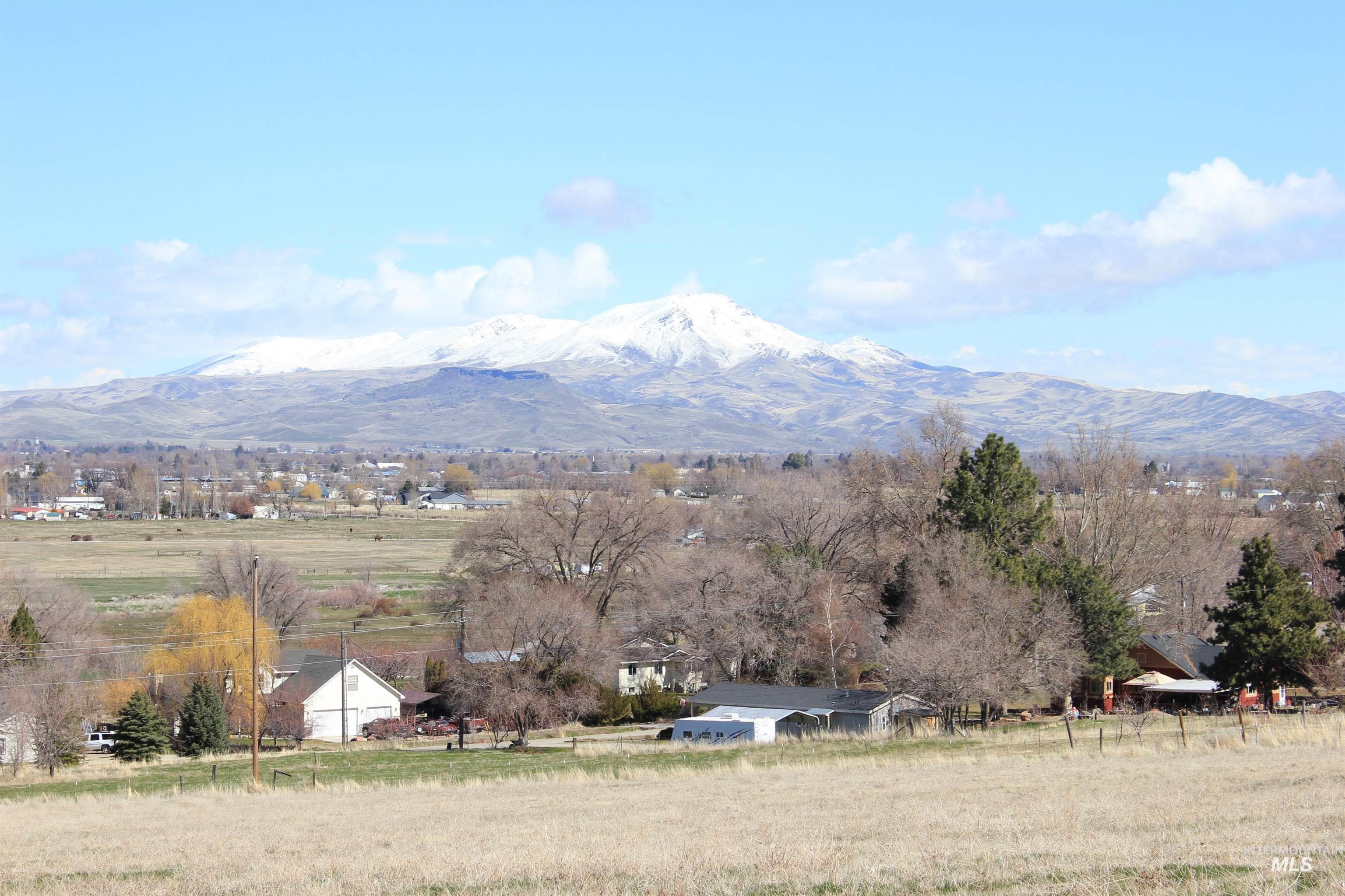 View of mountain background featuring rural landscape