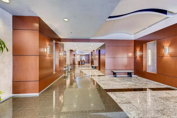 a view of a kitchen with a refrigerator and countertop
