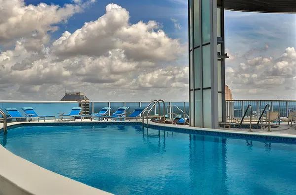 a view of a lake with tall buildings