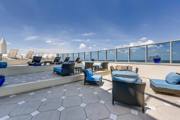 a lobby with furniture and a rug