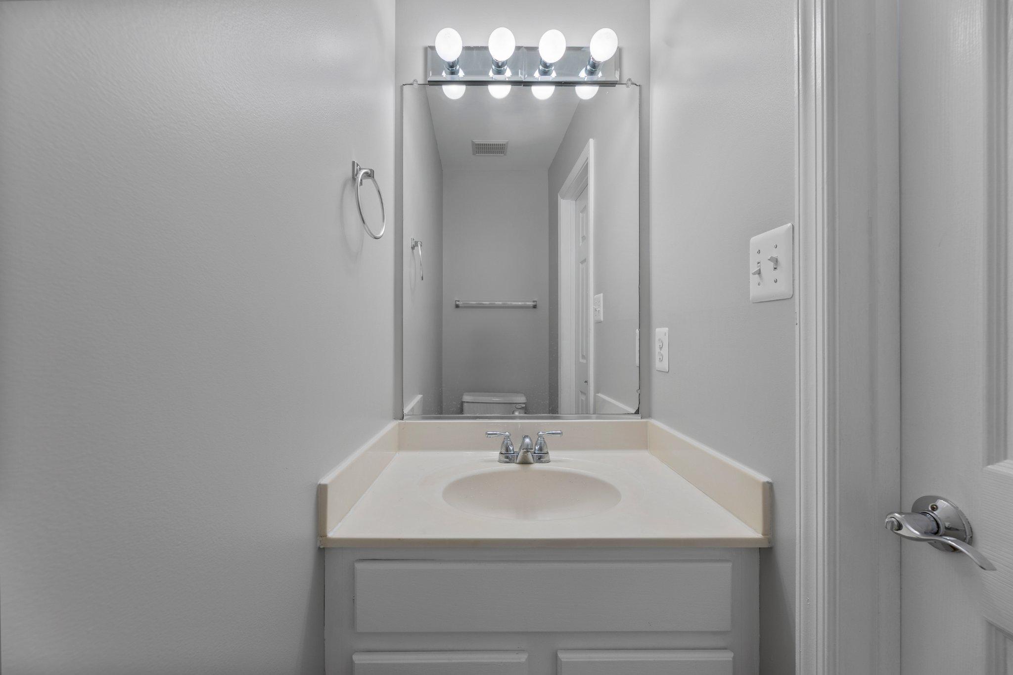 9241 Lorton Valley Road Lorton, VA 22079 - Photo 7 of 45 Half bath-freshly painted vanity and new flooring.