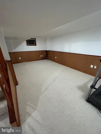 a view of a storage room with wooden floor