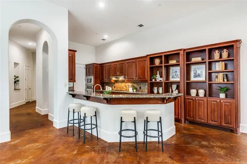 a view of a kitchen with furniture and staircase