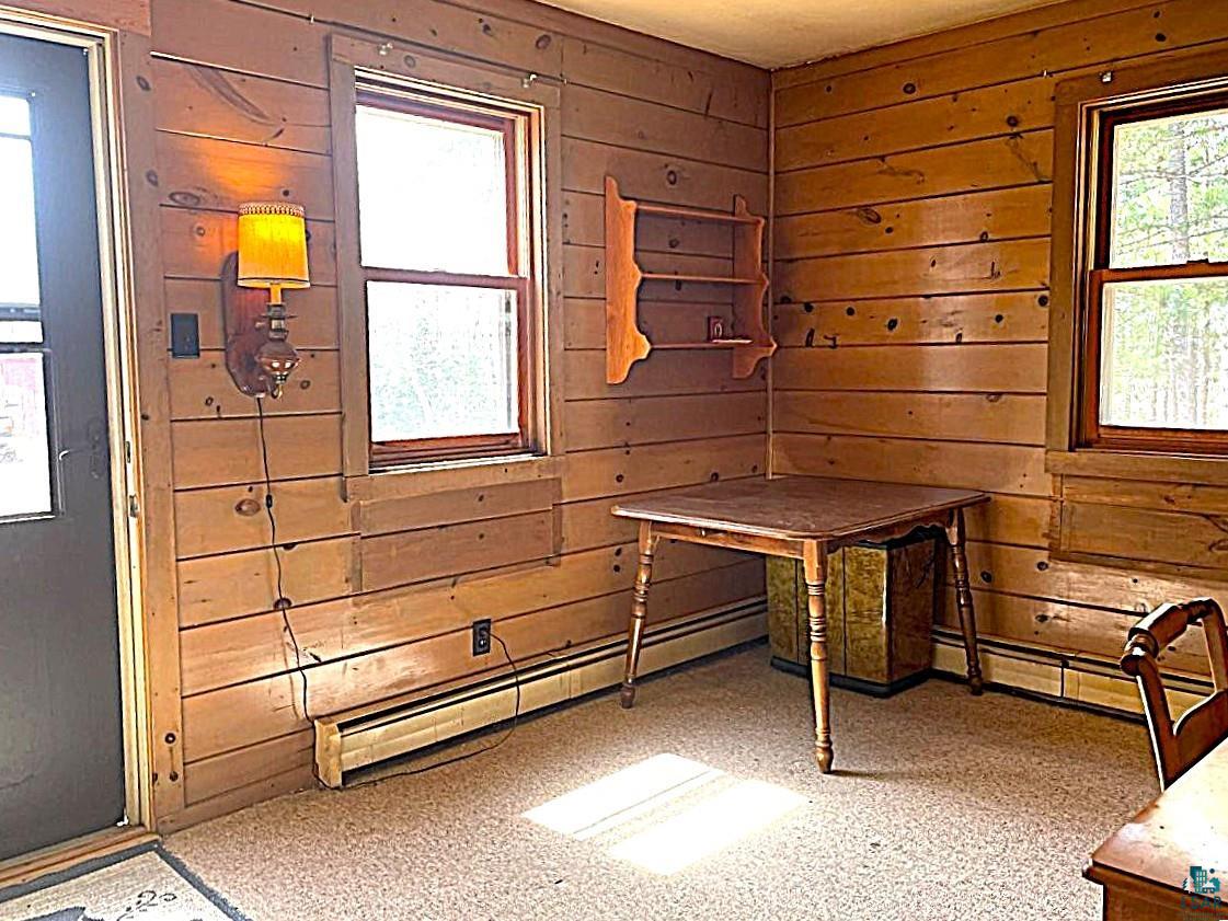 1480 Maijala Road Ely, MN 55731 - Photo 22 of 58 Room featuring horizontal wood paneling & outdoor access